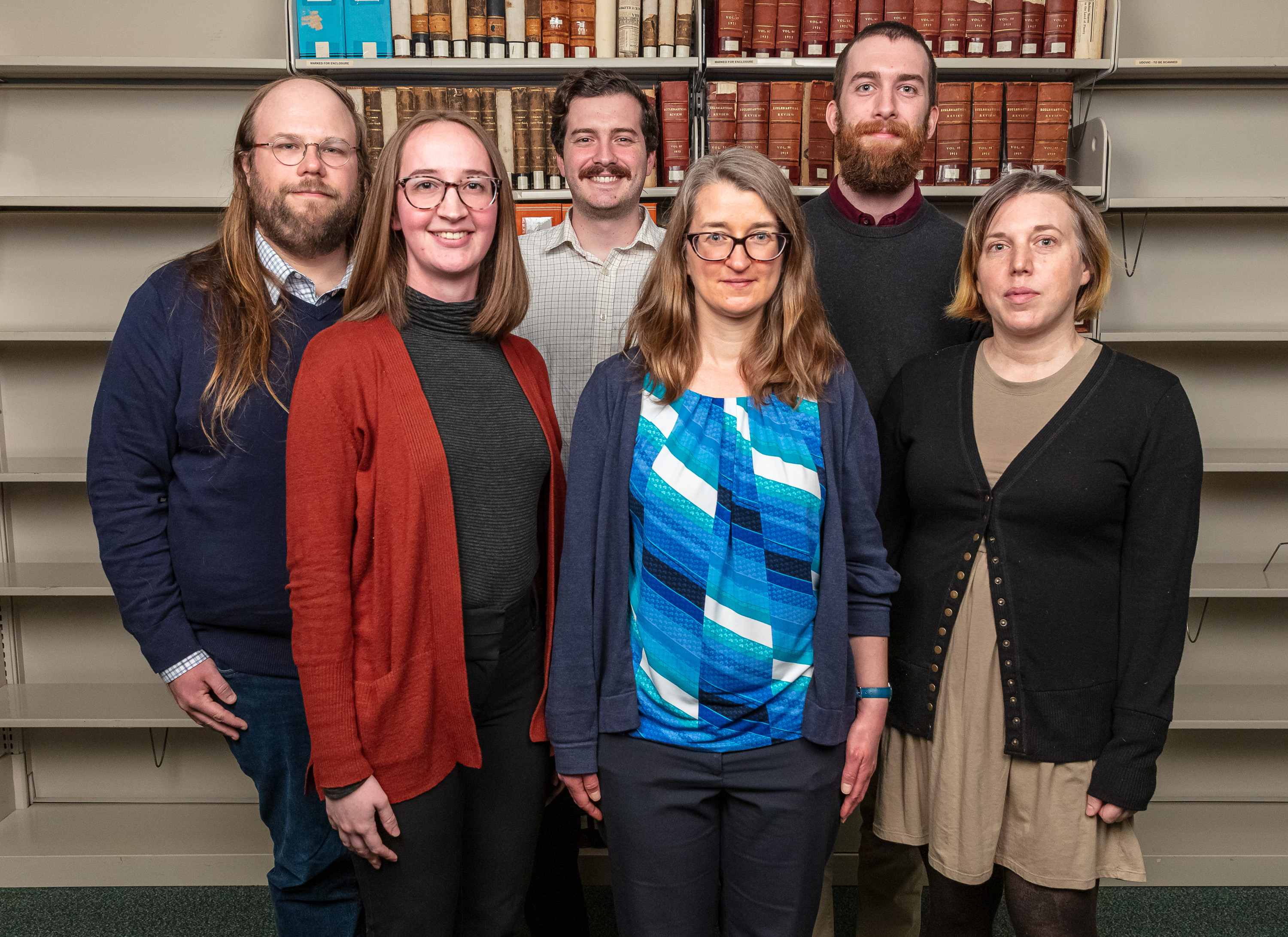 (Back row, left to right) David Sievers, Kyle Scheuring, Alec Munhall, (front row, left to right) Abigail Evans, Tami Luedtke and Audra Deemer serve on the library's technical services team. These staff ensure the DePaul community can access electronic resources including 488 research databases; 153,253 online journals; 727,797 ebooks and 212,173 digital media; and find the library’s 487,009 print books through LibrarySearch. Not pictured: Cary Cline, Stacey Reichard, Dorian Rodriguez Spicer and Renata Schneider. (DePaul University/Randall Spriggs)